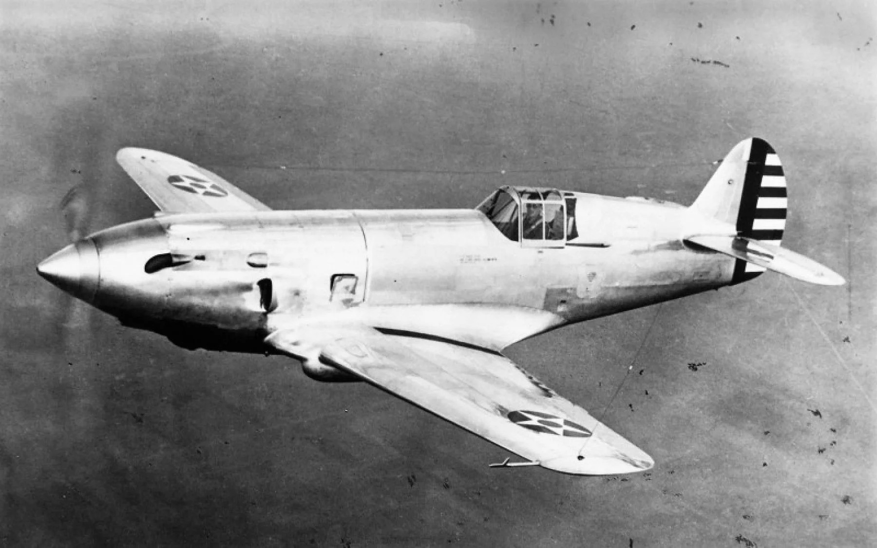 Can you identify this World War II-era American fighter prototype with its cockpit placed extremely far back?