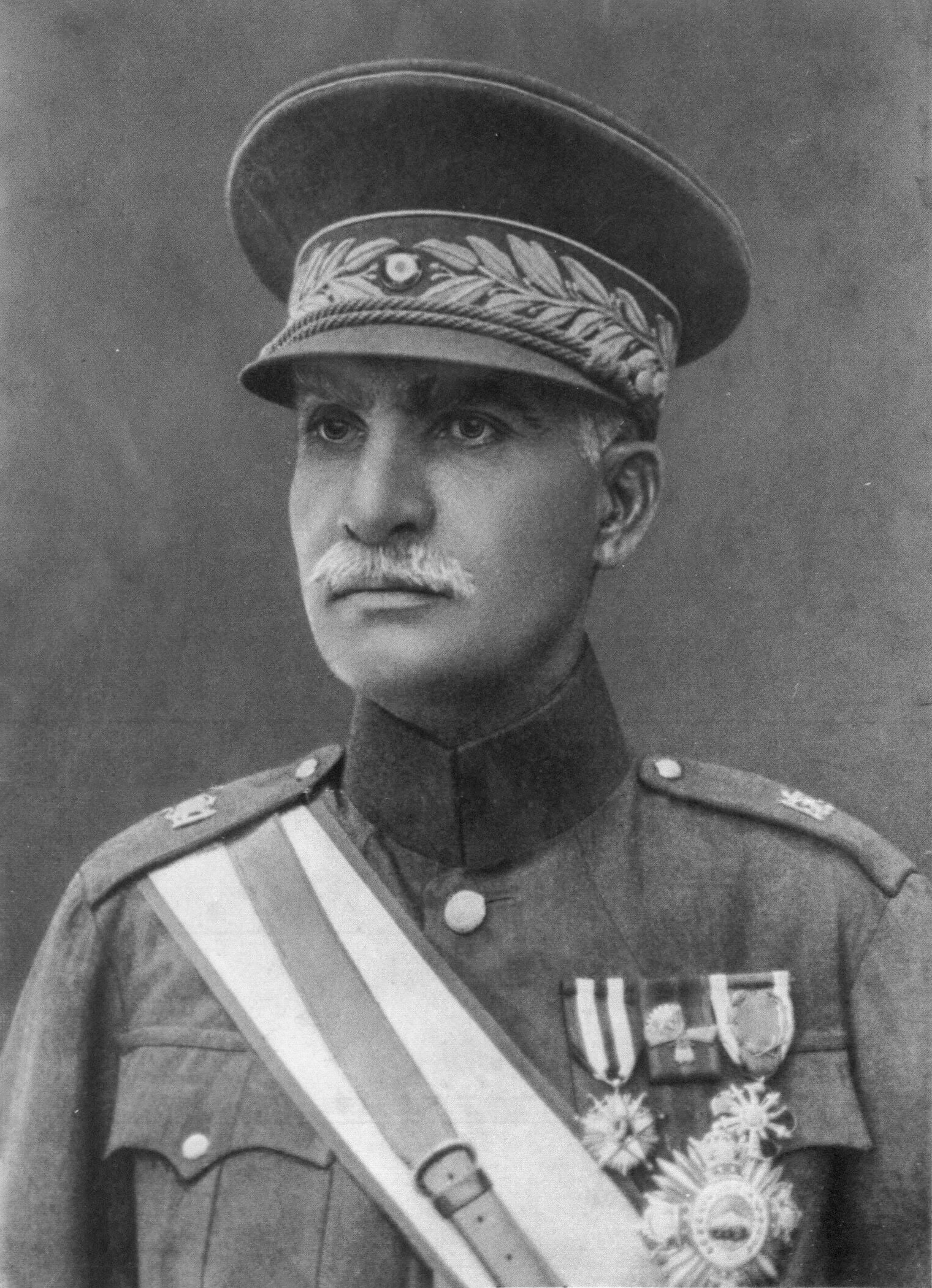 Reza Shah Pahlavi was Iran's shah (king) before and during World War II, until he was ousted by the British and the Soviets. What branch of the military did he serve in before he led a coup and became the ruler?