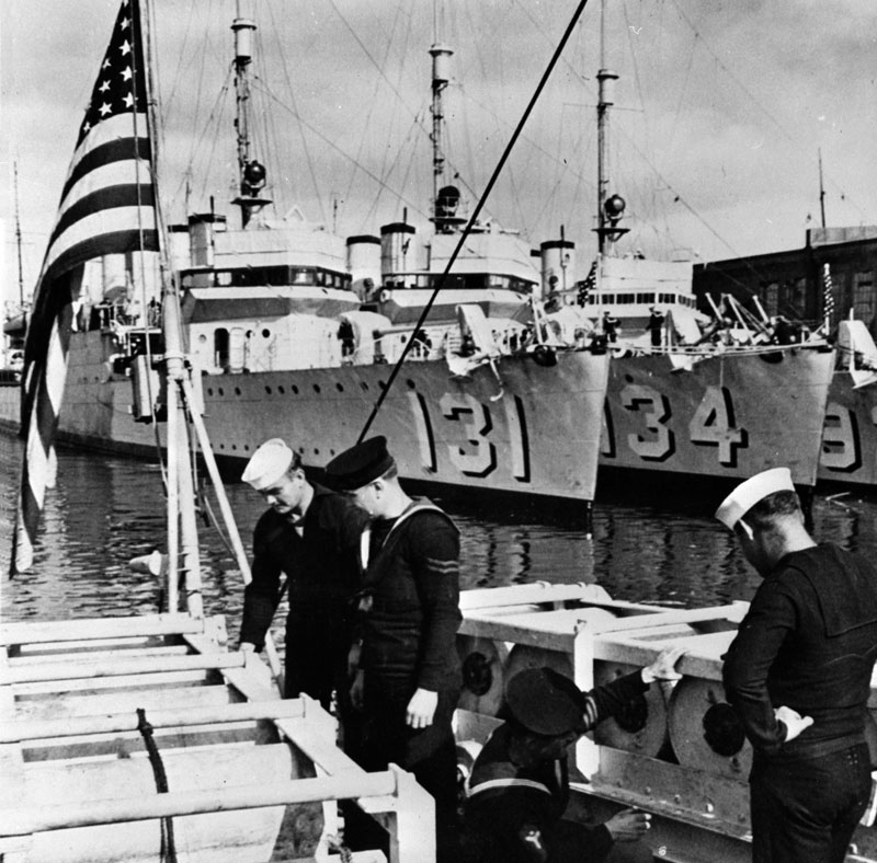 The United States gave the United Kingdom old destroyers in exchange for a lease on British-held lands suitable to build bases on as part of the destroyers-for-bases deal in 1940. How many destroyers were given to Britain and Canada?