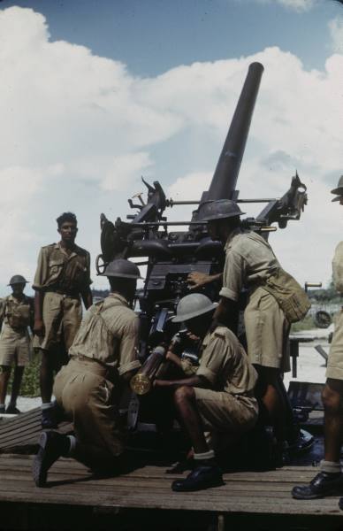 Singapore was a major British port in Asia, but it was taken by Japanese forces early in the war. Why were the port's heavy guns ineffective against the attacking ground troops?